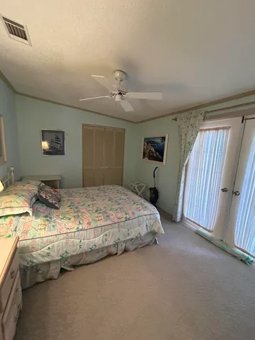 a bedroom with a bed and dresser