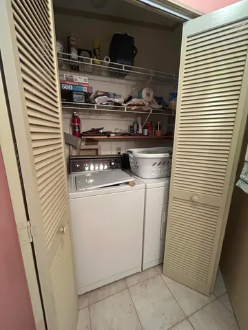 a spacious bathroom with a double vanity sink toilet and shower