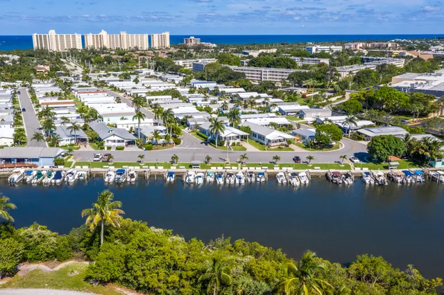 an aerial view of a house with a lake view