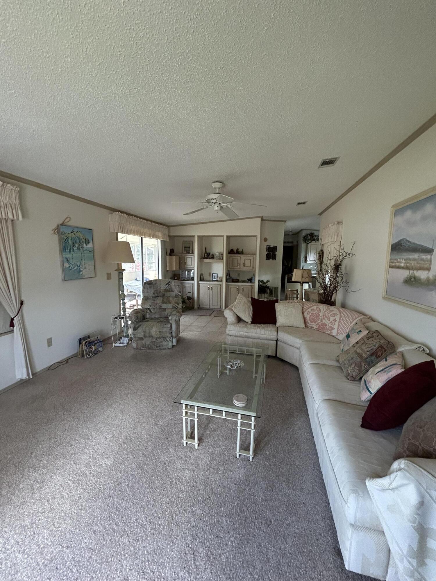 400 North Hwy A1A, Unit 47 Jupiter, FL 33477 - Photo 21 of 35 a living room with furniture and a couch