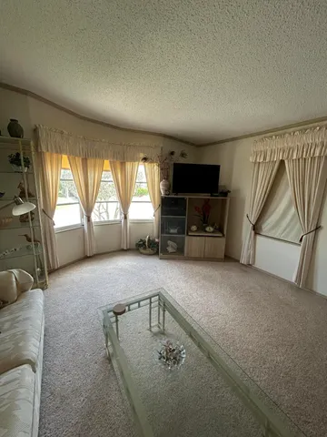 a view of a house with backyard and porch