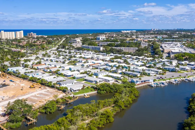 an aerial view of a houses with yard