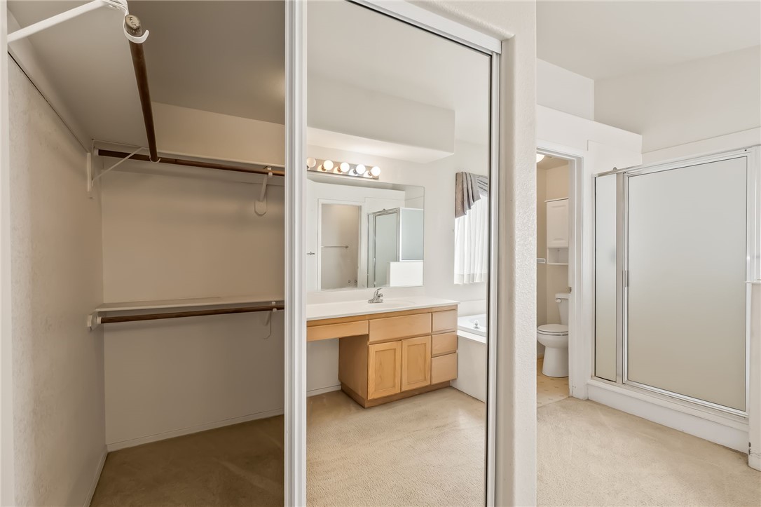 2853 Winchester Road Bullhead City, AZ 86442 - Photo 25 of 40 The bathroom features a vanity with a sink, a mirror with vanity lighting, and a bathtub