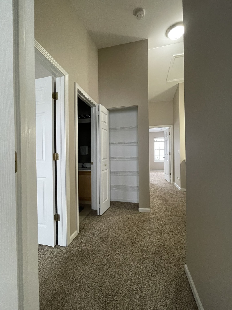 578 Triumph Court, Unit 578 Hainesville, IL 60073 - Photo 11 of 20 a view of an empty room with closet and a window