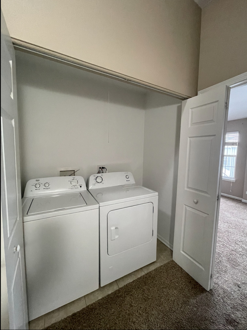 578 Triumph Court, Unit 578 Hainesville, IL 60073 - Photo 12 of 20 a utility room with dryer and washer