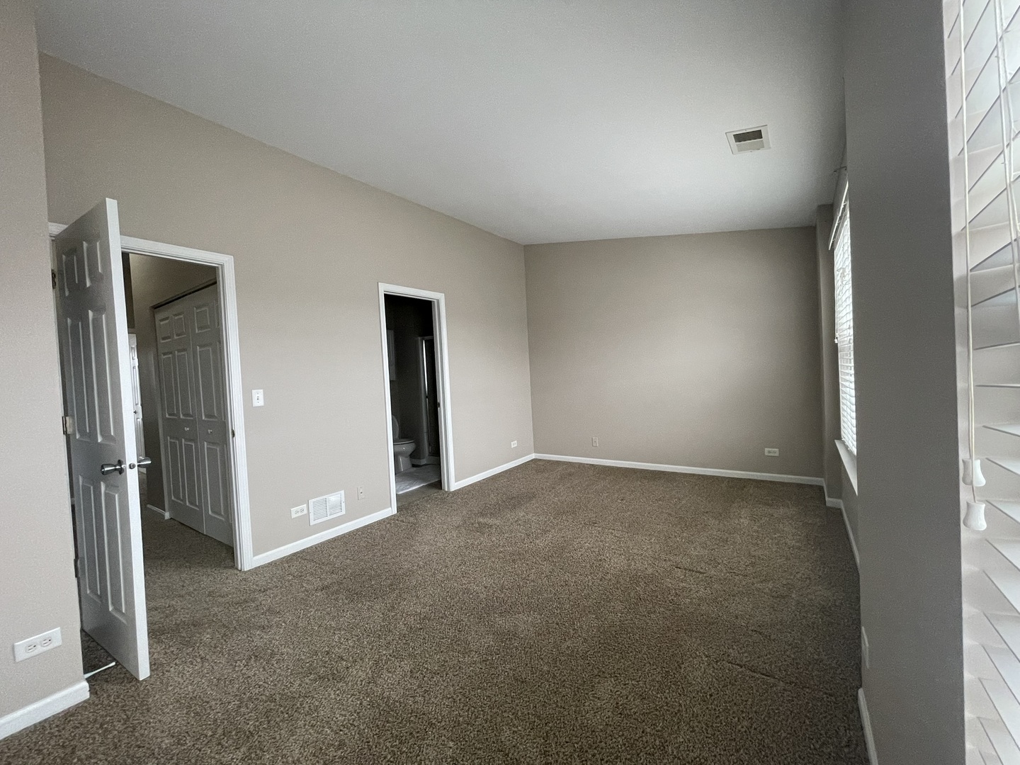 578 Triumph Court, Unit 578 Hainesville, IL 60073 - Photo 14 of 20 a view of an empty room and a window