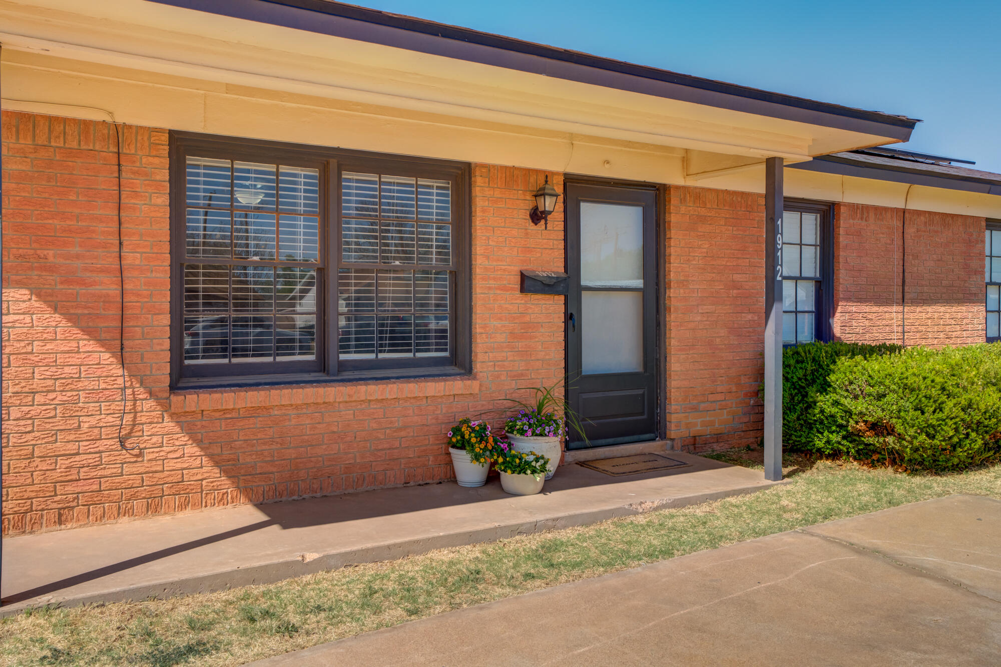 1912 69th Street Lubbock, TX 79412 - Photo 1 of 41 a front view of a house