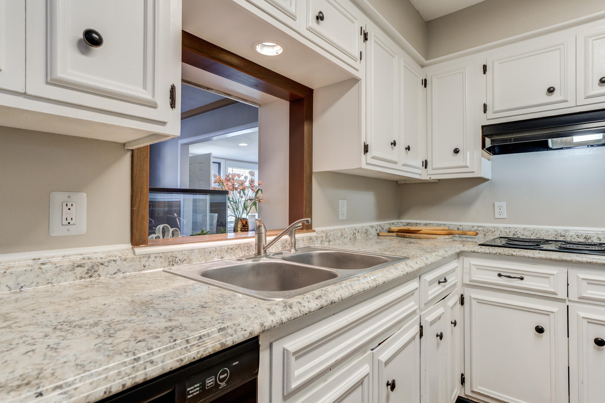 1912 69th Street Lubbock, TX 79412 - Photo 17 of 41 a kitchen with granite countertop white cabinets and a sink