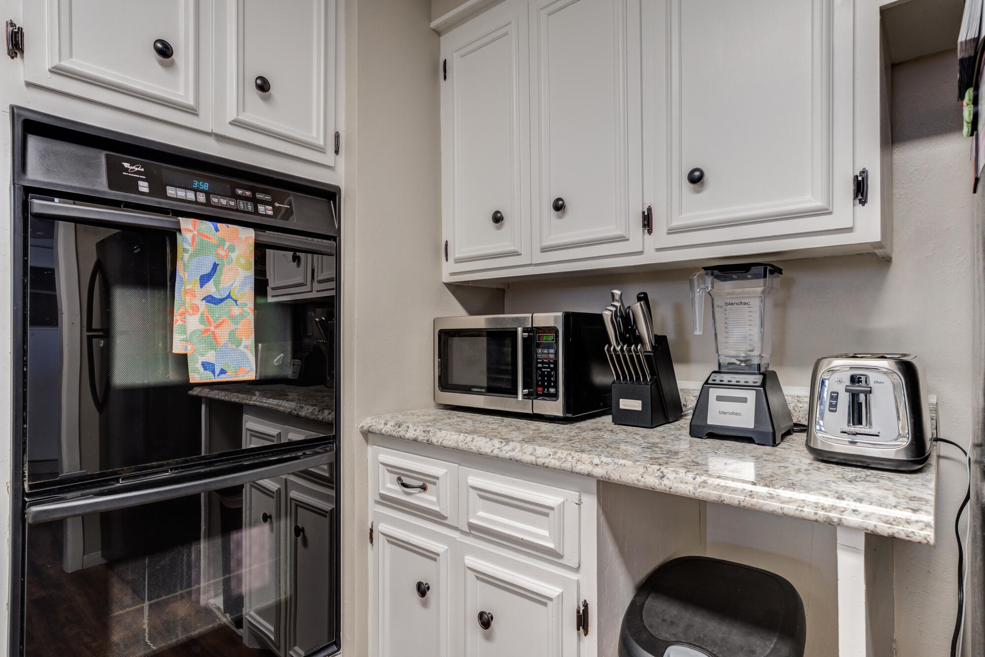 1912 69th Street Lubbock, TX 79412 - Photo 19 of 41 a kitchen with granite countertop white cabinets and stainless steel appliances