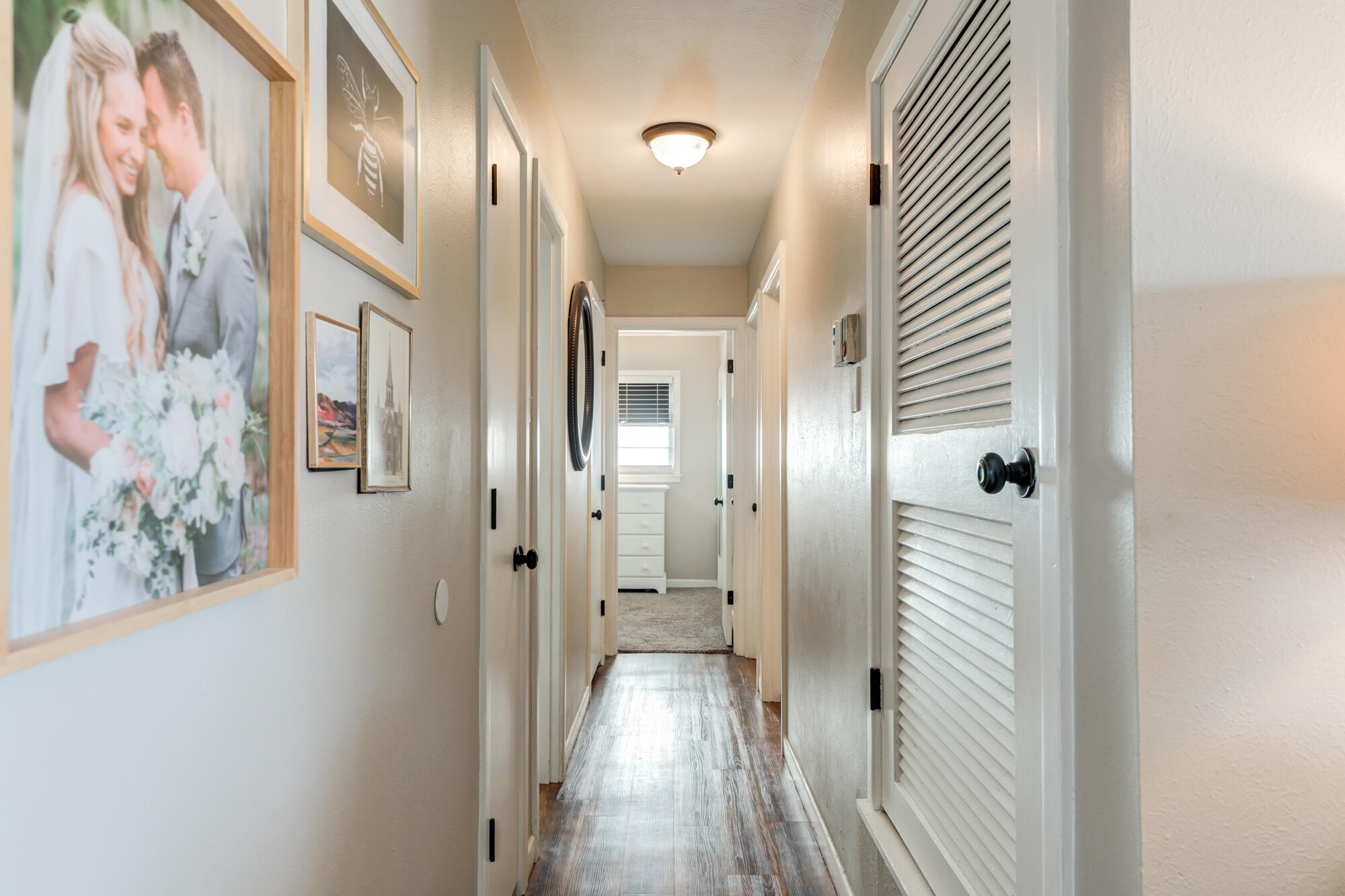 1912 69th Street Lubbock, TX 79412 - Photo 23 of 41 a view of a hallway with wooden floor