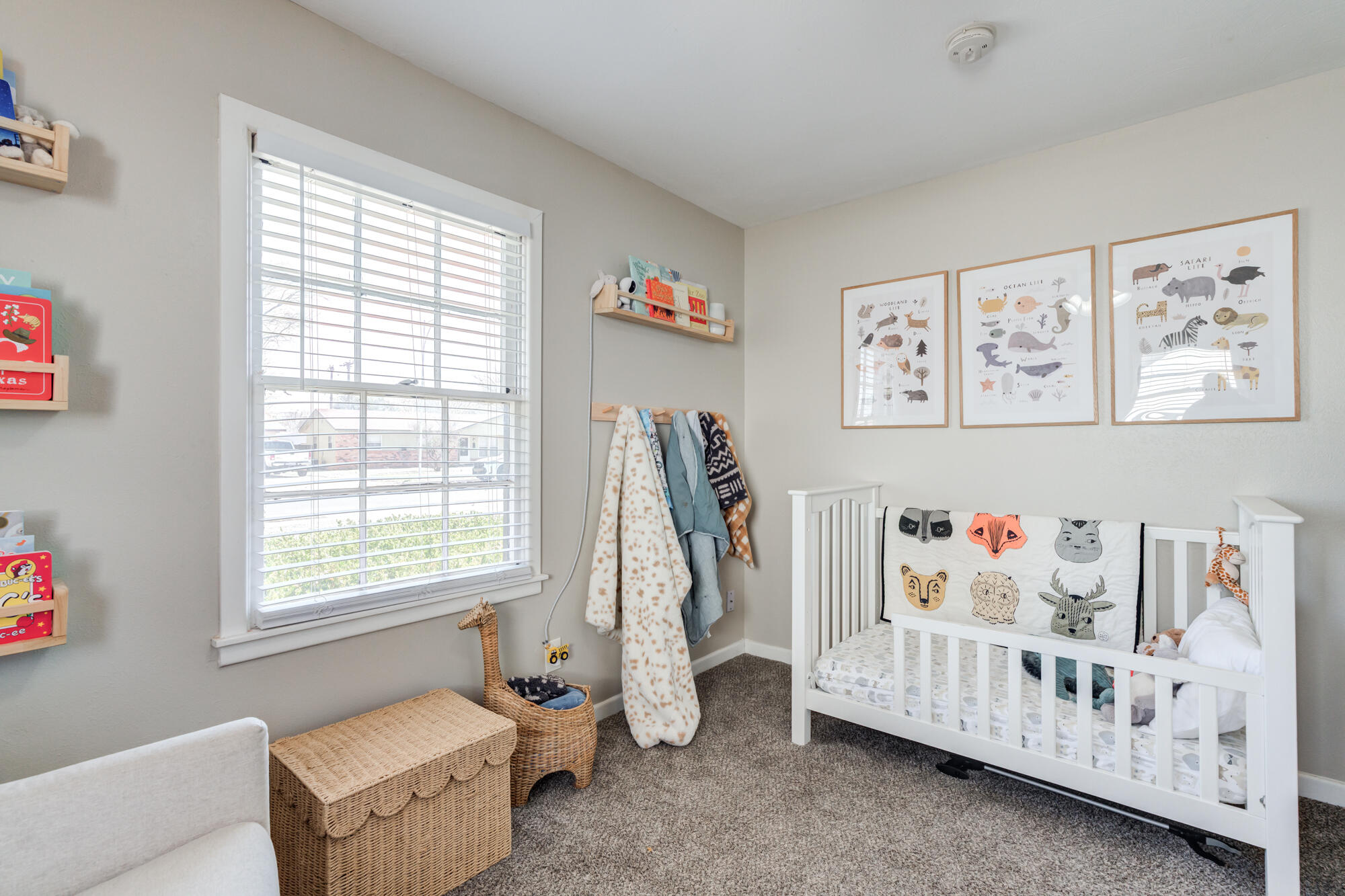 1912 69th Street Lubbock, TX 79412 - Photo 29 of 41 a bedroom with baby toys and a window