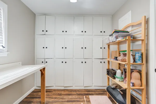 a view of kitchen with wooden floor and electronic appliances