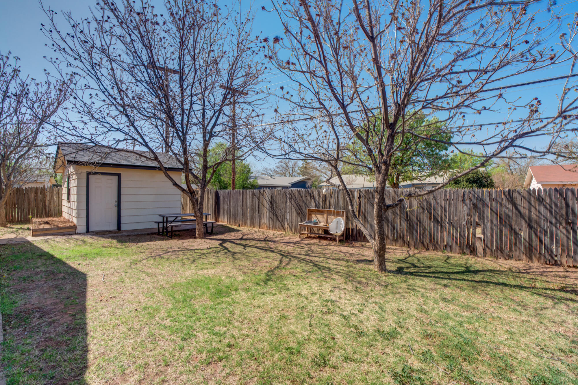 1912 69th Street Lubbock, TX 79412 - Photo 39 of 41 a view of a house with backyard and tree