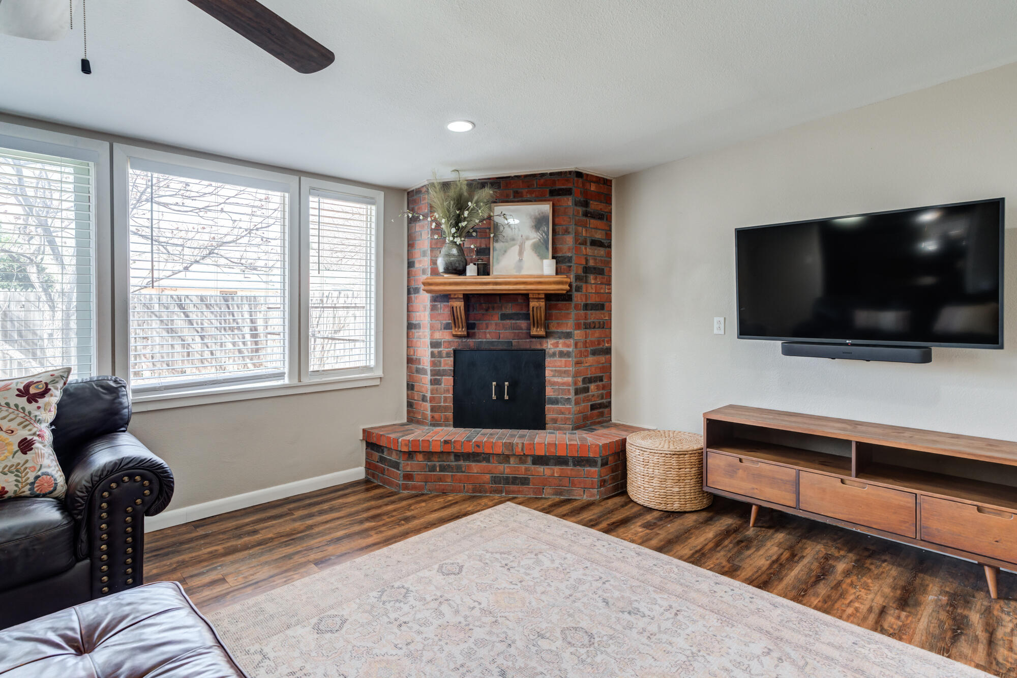 1912 69th Street Lubbock, TX 79412 - Photo 4 of 41 a living room with furniture and a flat screen tv