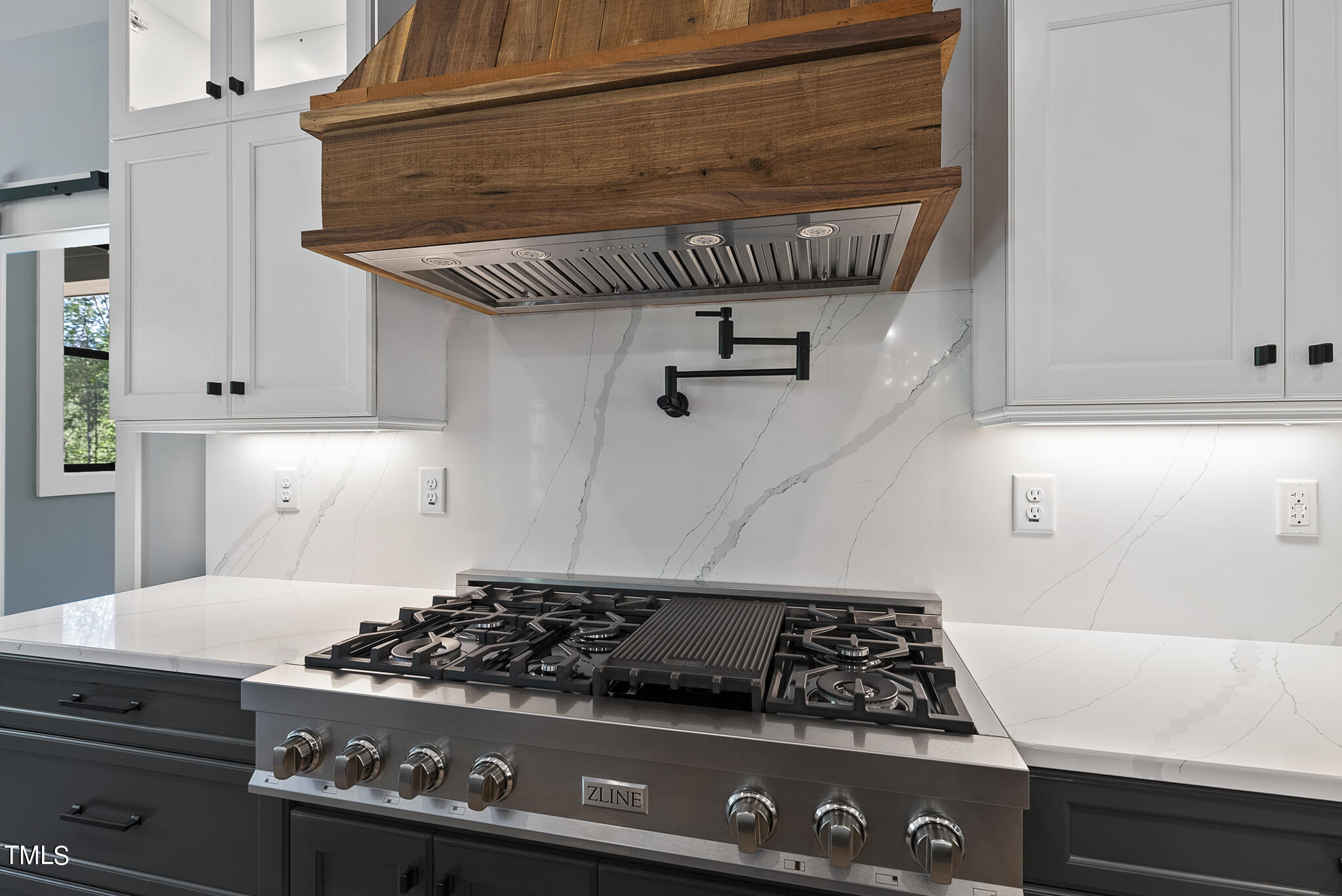 190 Pilot Ridge Road Zebulon, NC 27597 - Photo 14 of 55 a kitchen with a stove and white cabinets