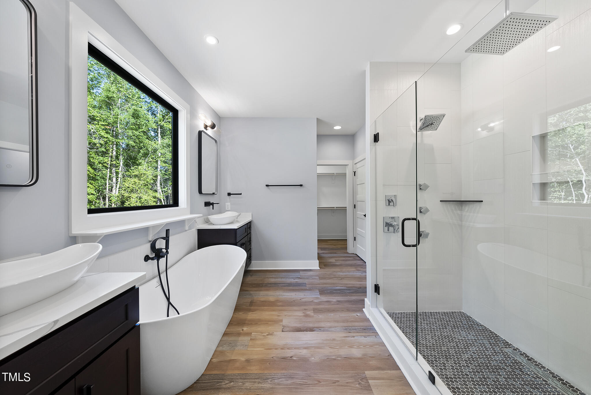 190 Pilot Ridge Road Zebulon, NC 27597 - Photo 33 of 55 a bathroom with a sink a mirror and a shower