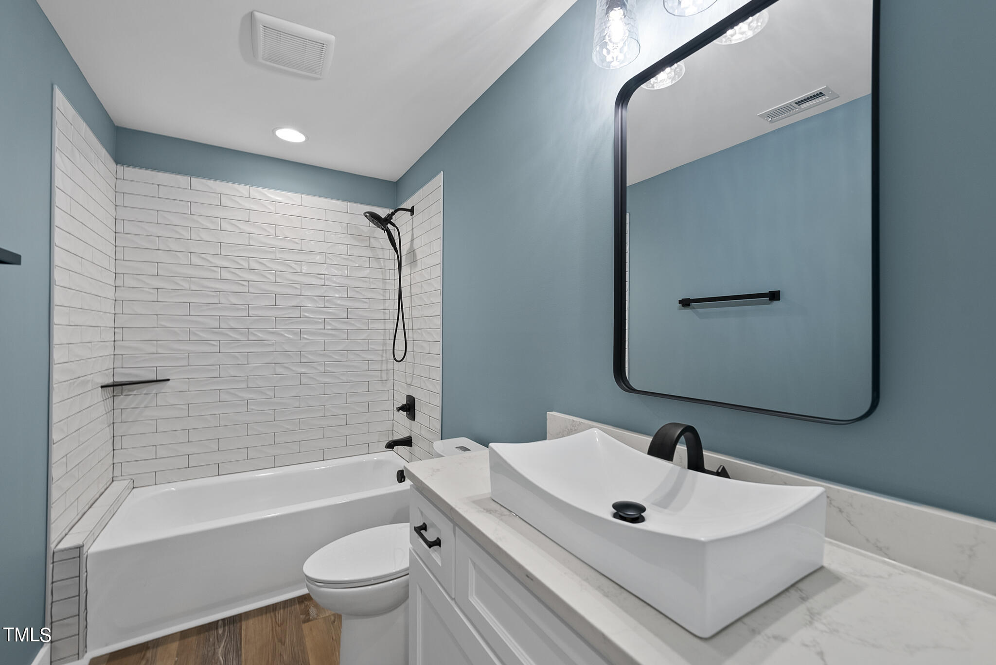 190 Pilot Ridge Road Zebulon, NC 27597 - Photo 47 of 55 a bathroom with a white tub sink vanity mirror and toilet