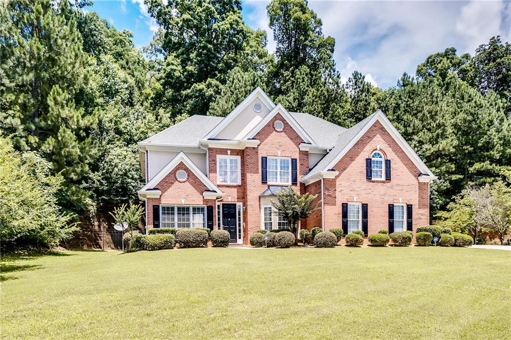 1342 Cascade Falls Court Atlanta, GA 30311 - Photo 1 of 1 a front view of a house with a yard and garage