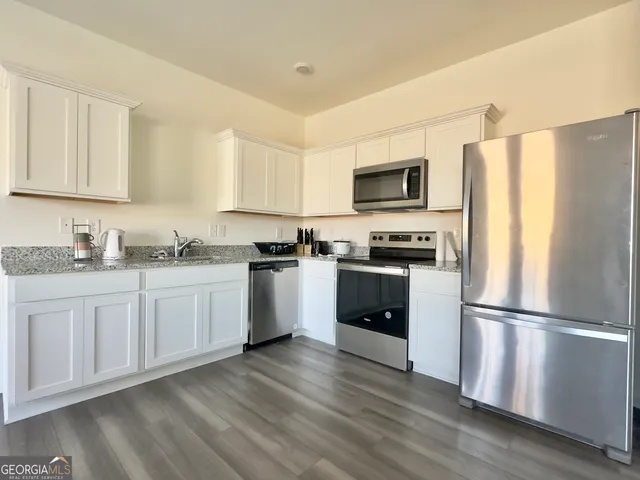 a bedroom with bed and window