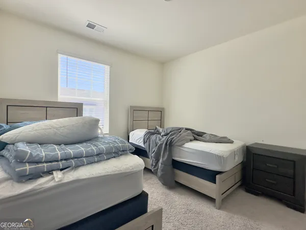 a room with a bed and a window