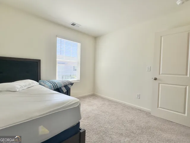 a bathroom with a sink toilet vanity and shower