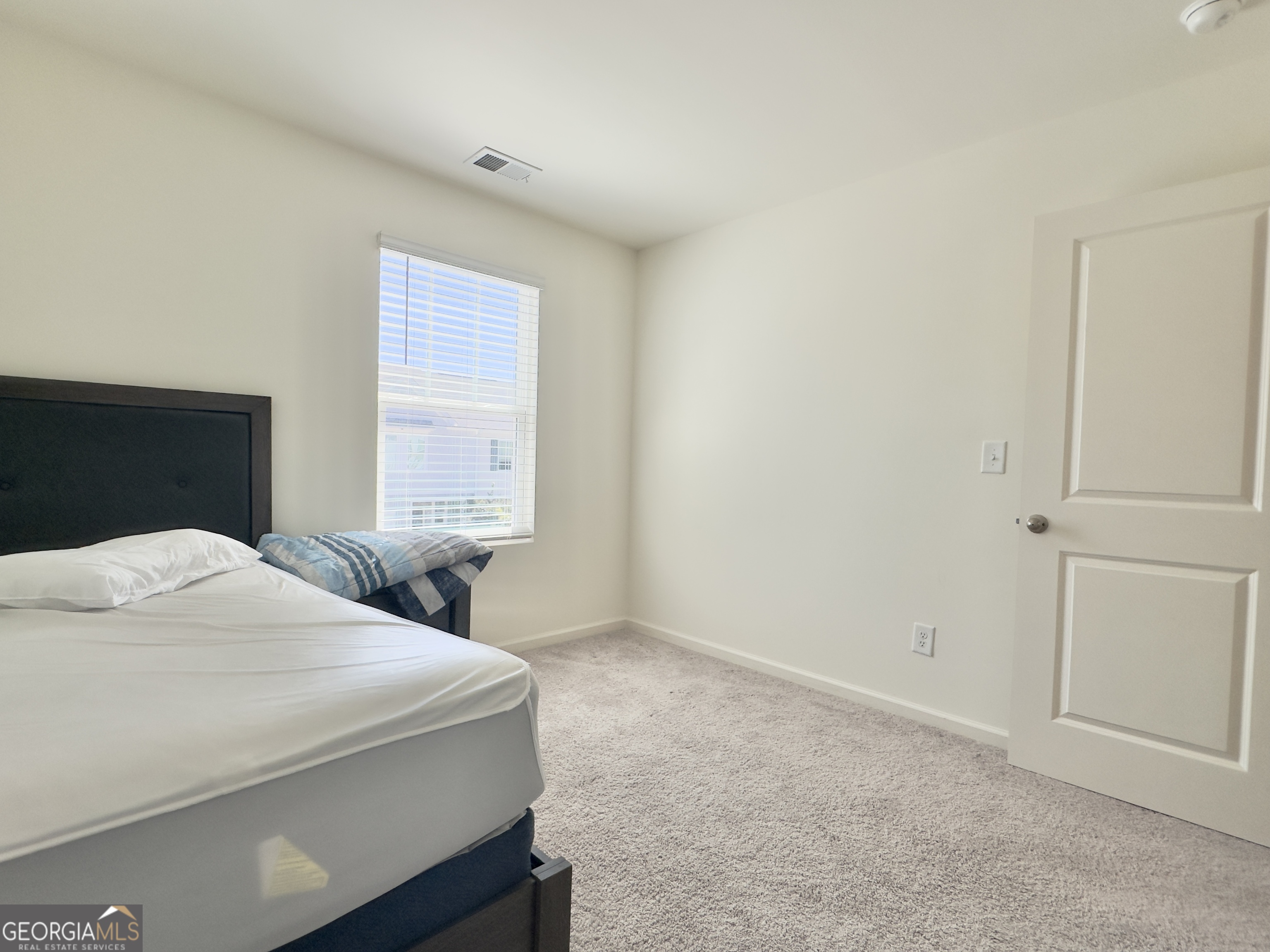 107 Ellicott Way Cartersville, GA 30120 - Photo 21 of 25 a bedroom with a bed and a window