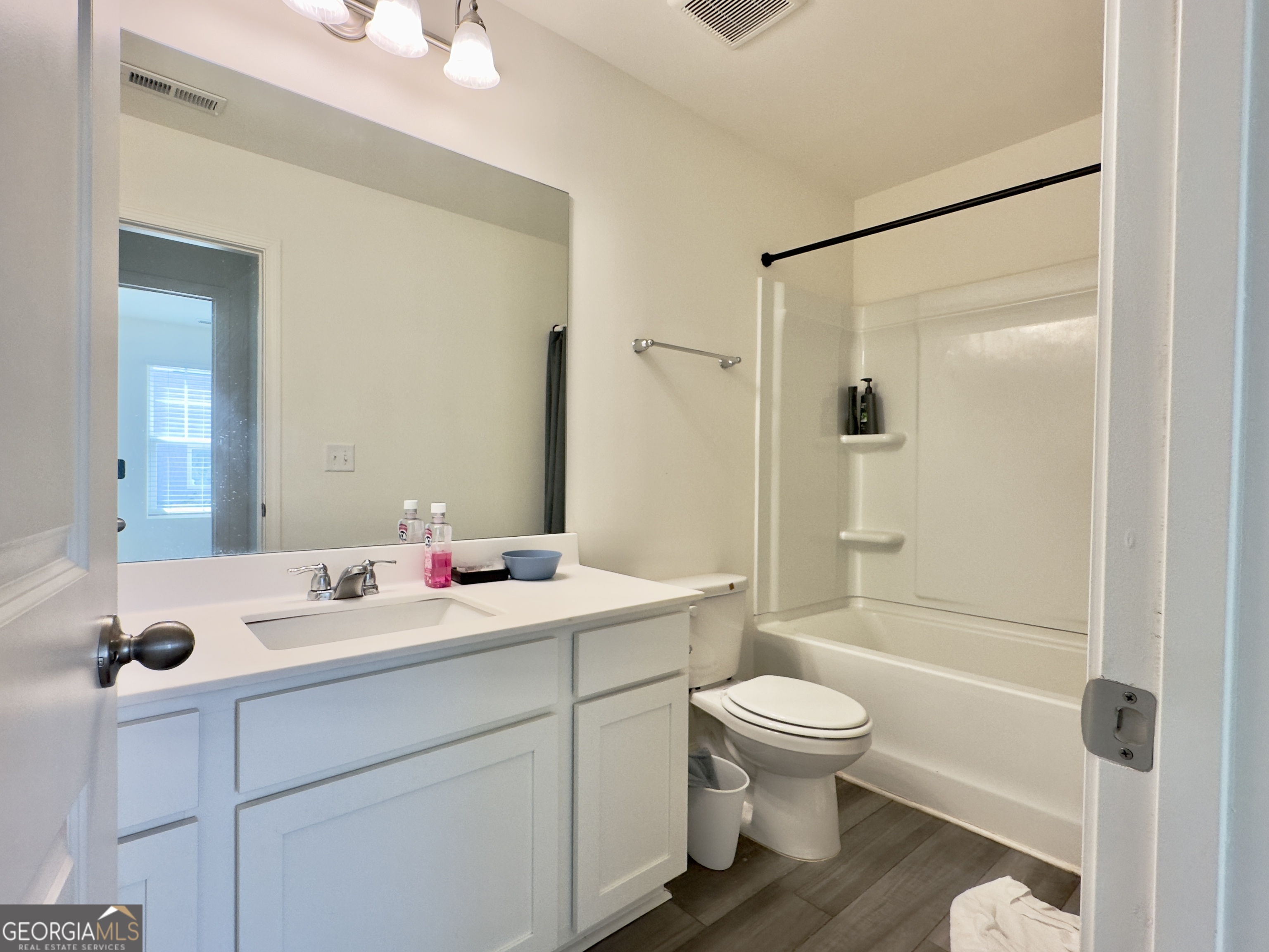 107 Ellicott Way Cartersville, GA 30120 - Photo 23 of 25 a bathroom with a sink toilet vanity and shower