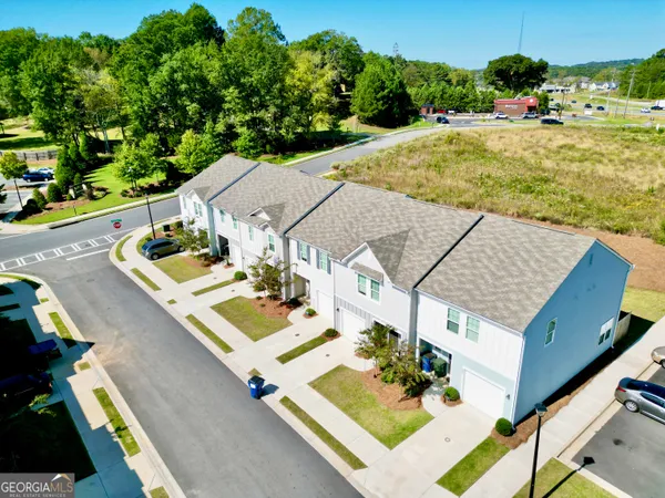 an aerial view of house with yard