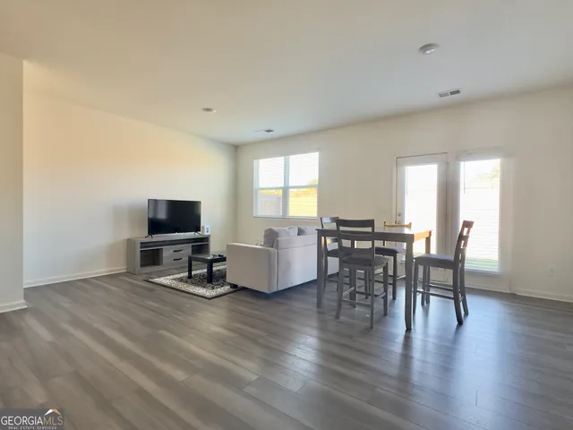 a bedroom with two beds and a window
