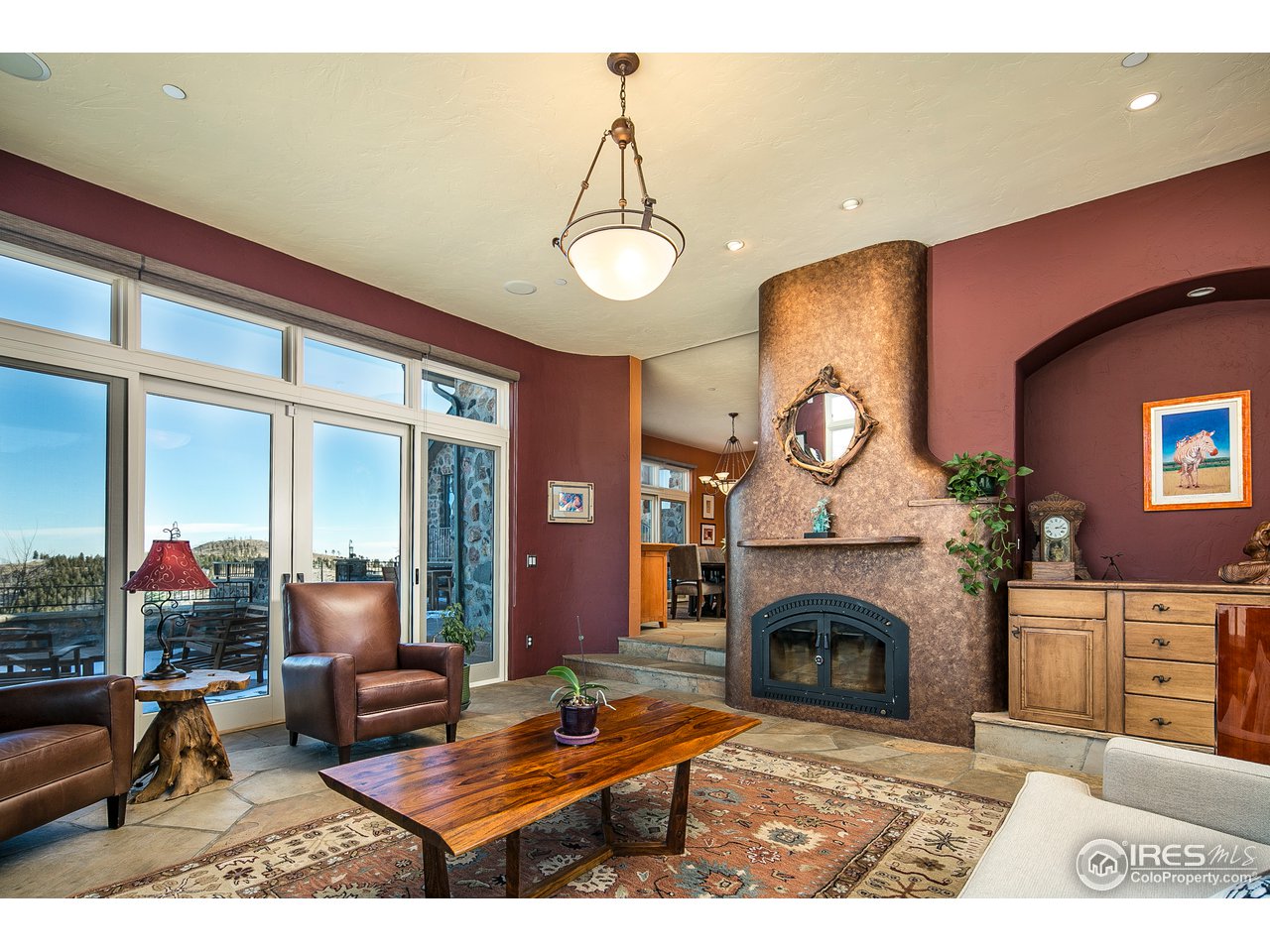 355 Mountain King Road Boulder, CO 80302 - Photo 13 of 34 a living room with furniture a fireplace and a table