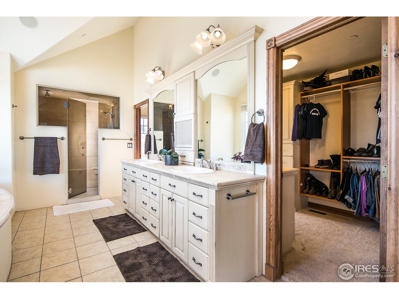 355 Mountain King Road Boulder, CO 80302 - Photo 16 of 34 a spacious bathroom with a double vanity sink a mirror and a