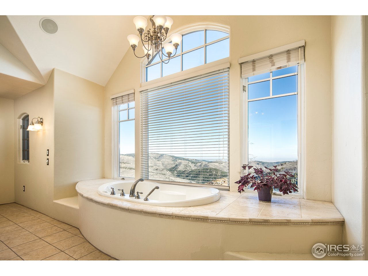355 Mountain King Road Boulder, CO 80302 - Photo 18 of 34 a bathroom with a tub sink and mirror