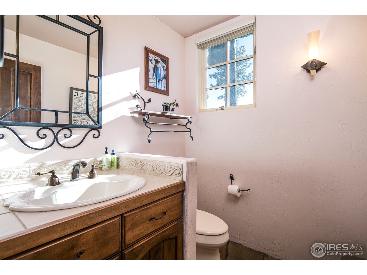 355 Mountain King Road Boulder, CO 80302 - Photo 23 of 34 a bathroom with a toilet sink and mirror