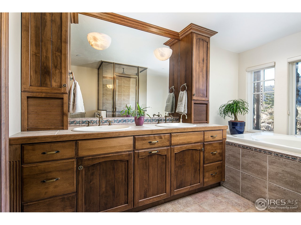 355 Mountain King Road Boulder, CO 80302 - Photo 28 of 34 a bathroom with a double vanity sink and a mirror