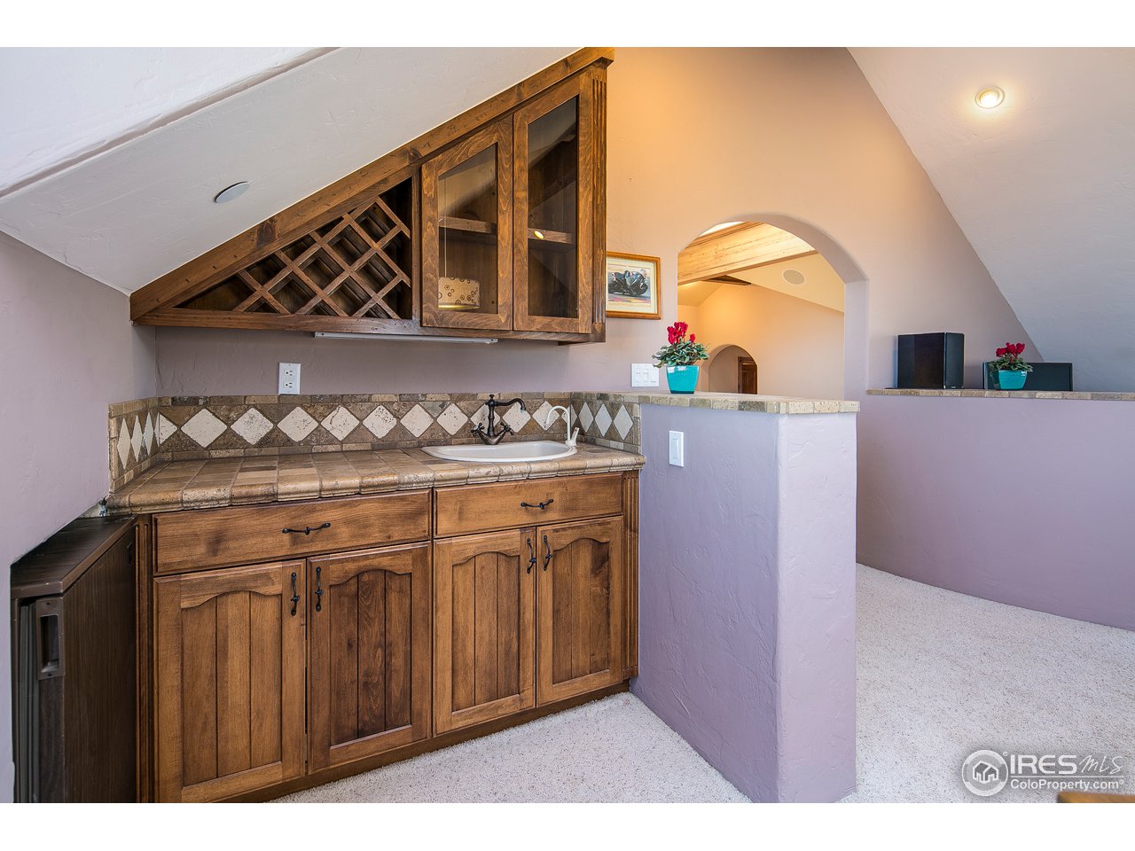 355 Mountain King Road Boulder, CO 80302 - Photo 32 of 34 a kitchen with stainless steel appliances granite countertop a stove and a sink