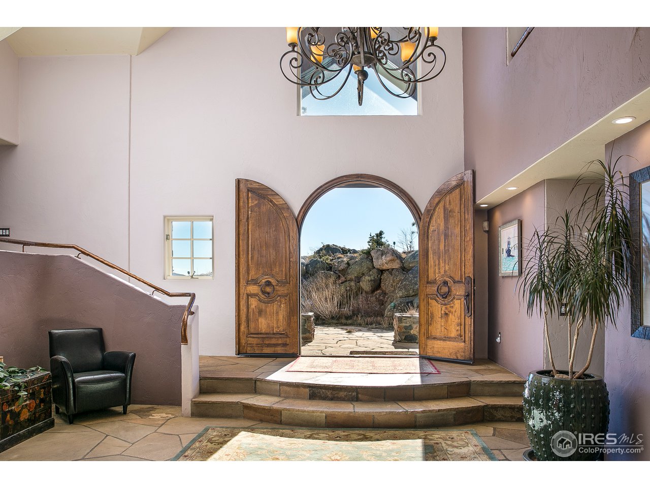 355 Mountain King Road Boulder, CO 80302 - Photo 6 of 34 a view of a hallway with paintings on the wall