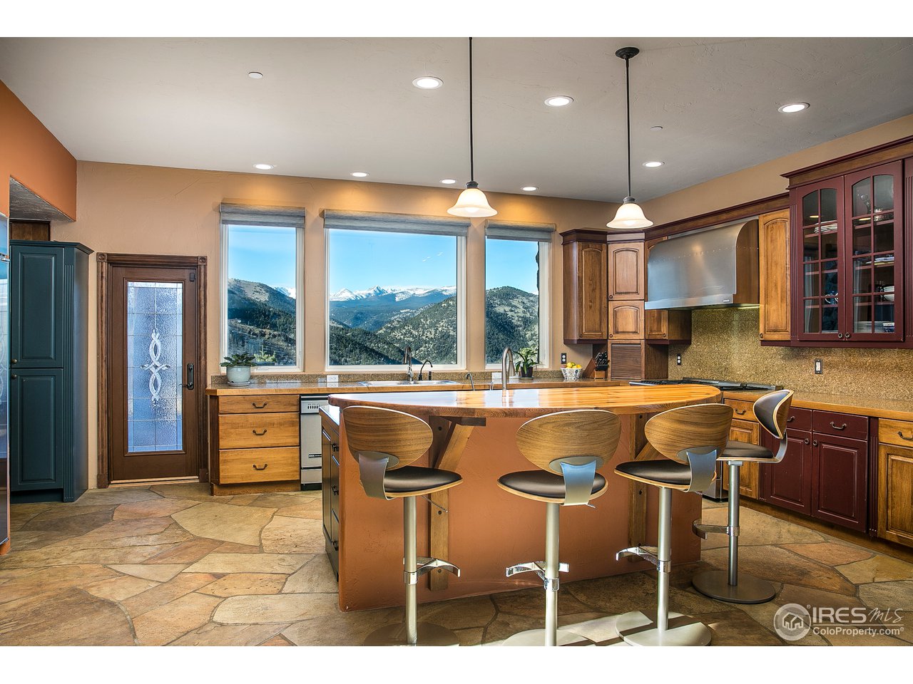 355 Mountain King Road Boulder, CO 80302 - Photo 9 of 34 a dinning table and chairs in a room