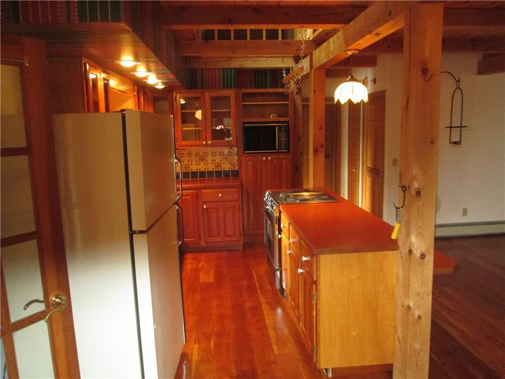 214 Desert Pond Road Mount Vernon, ME 04352 - Photo 6 of 24 custom kitchen with island, cooktop