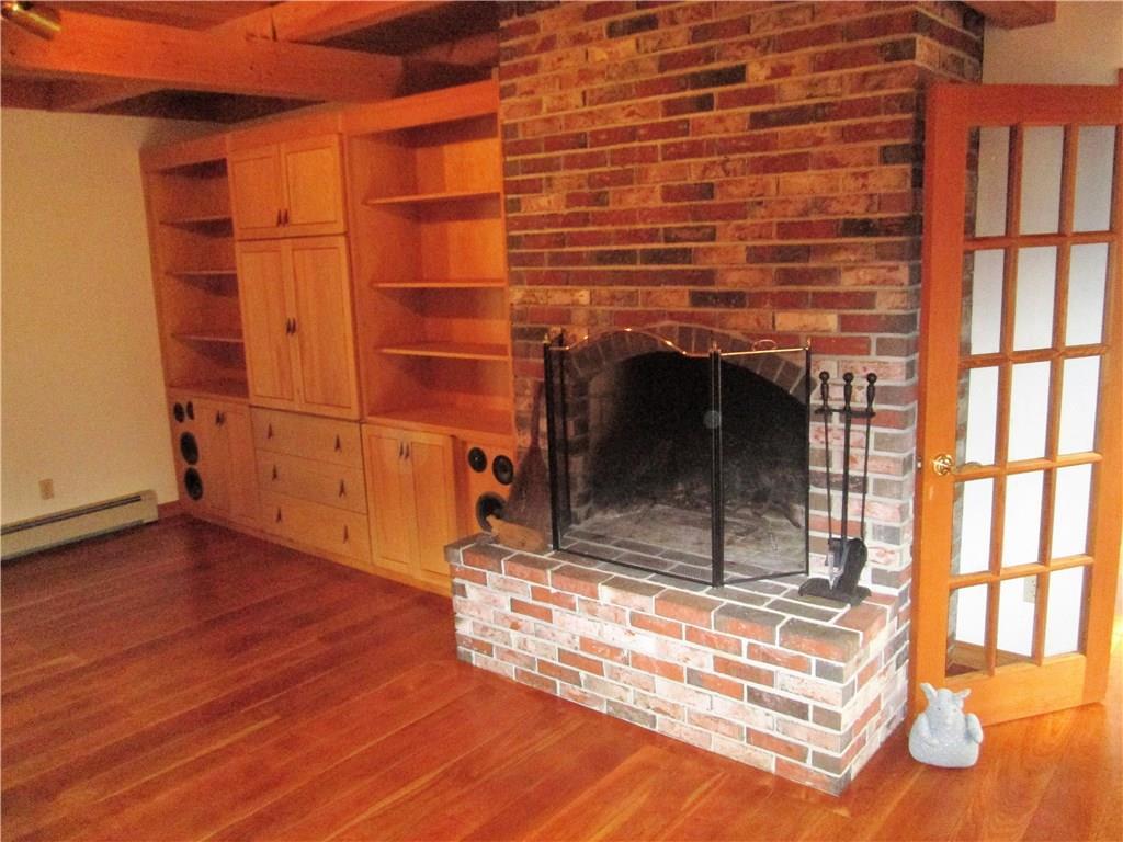 214 Desert Pond Road Mount Vernon, ME 04352 - Photo 10 of 24 living room with fireplace, built-in...