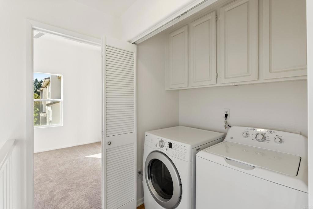 1276 San Elijo Road South San Marcos, CA 92078 - Photo 16 of 34 a view of storage and utility room with washer and dryer