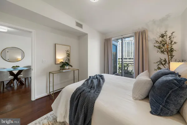 a bedroom with a bed and window