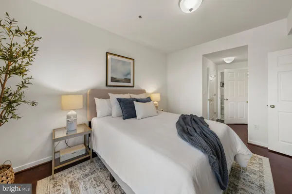 a bedroom with bed and window