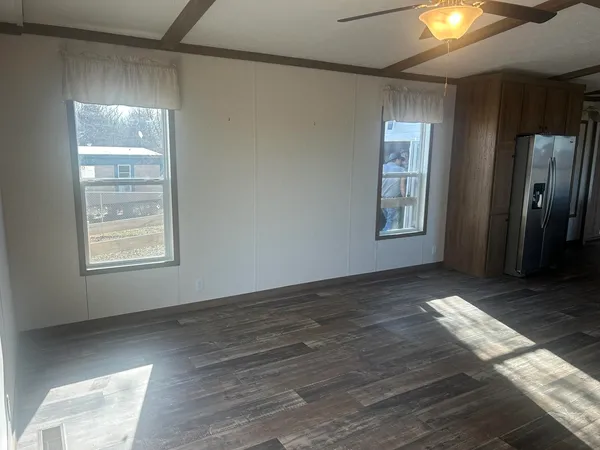 a view of a kitchen with a stove and a cabinet