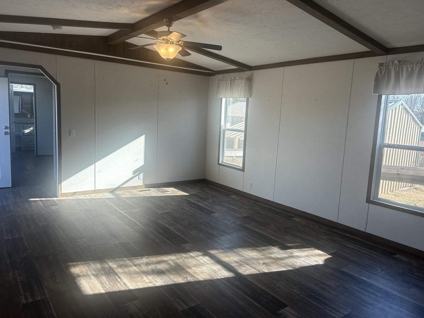 3115 Tunnel Hill Road Ozark, IL 62972 - Photo 18 of 36 a view of an empty room with wooden floor and a window