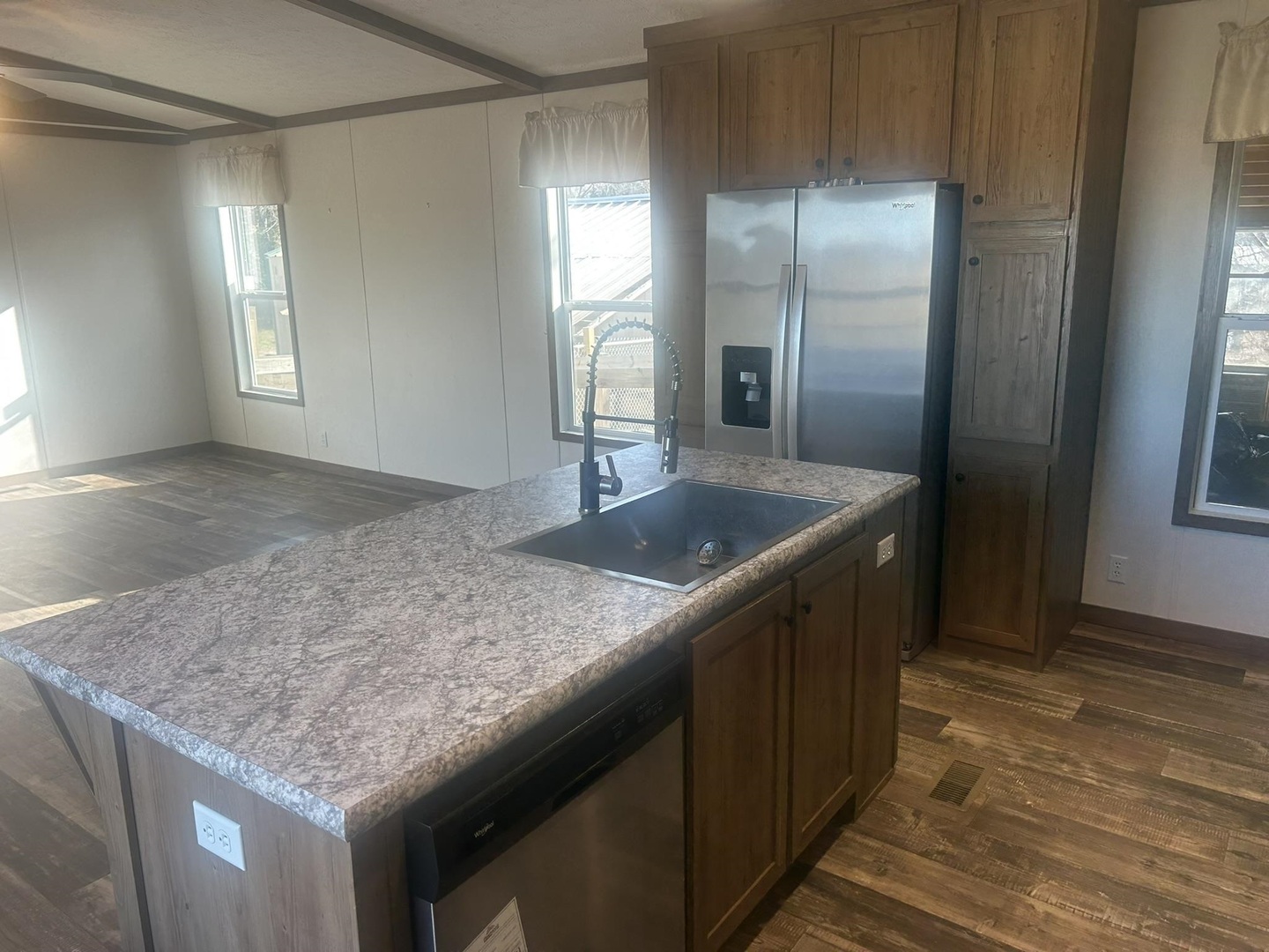 3115 Tunnel Hill Road Ozark, IL 62972 - Photo 21 of 36 a kitchen with stainless steel appliances granite countertop a sink and a refrigerator