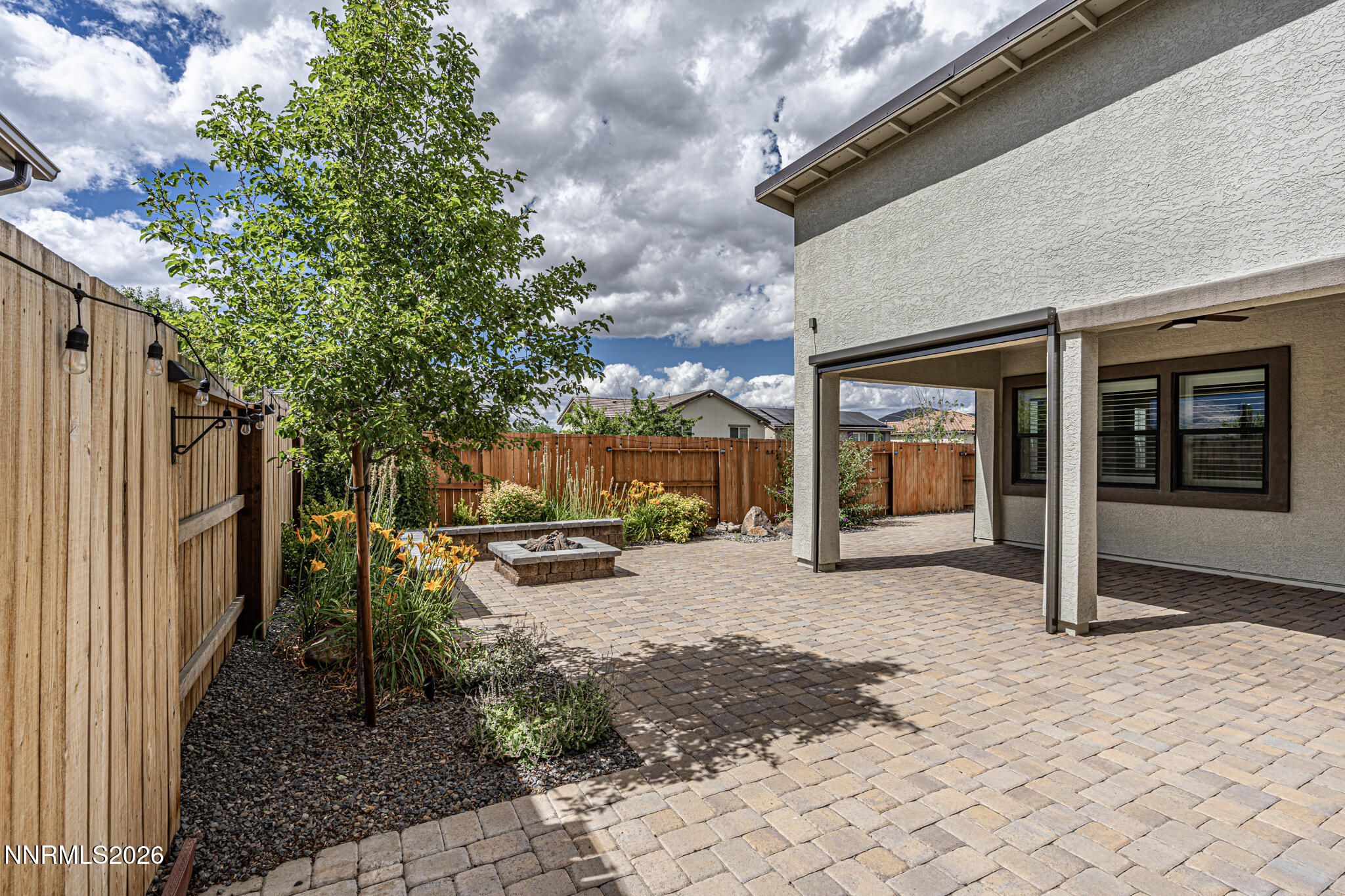 2109 Cast Iron Drive Reno, NV 89521 - Photo 26 of 35 a view of a chairs and fire pit in backyard of the house