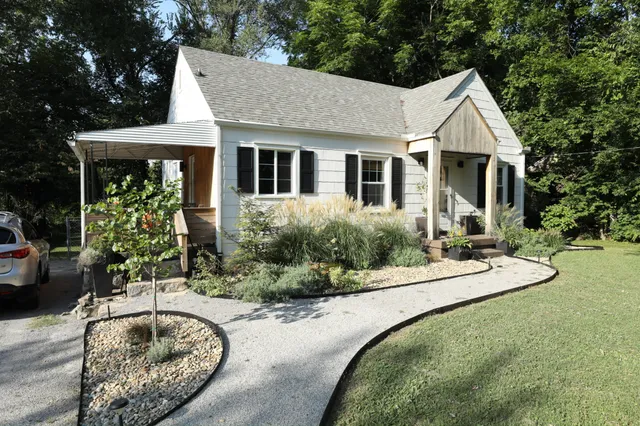 a house with swimming pool in front of it