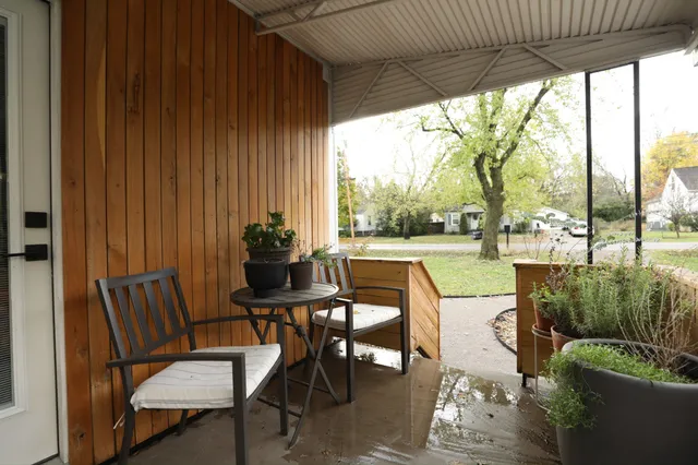 a view of a porch with furniture and yard