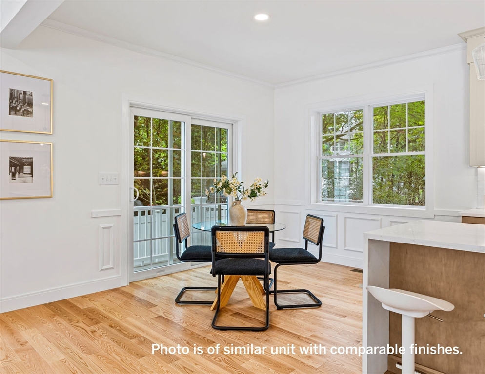 75 Franklin Street, Unit 1 Arlington, MA 02474 - Photo 13 of 36 a living room with furniture and a window