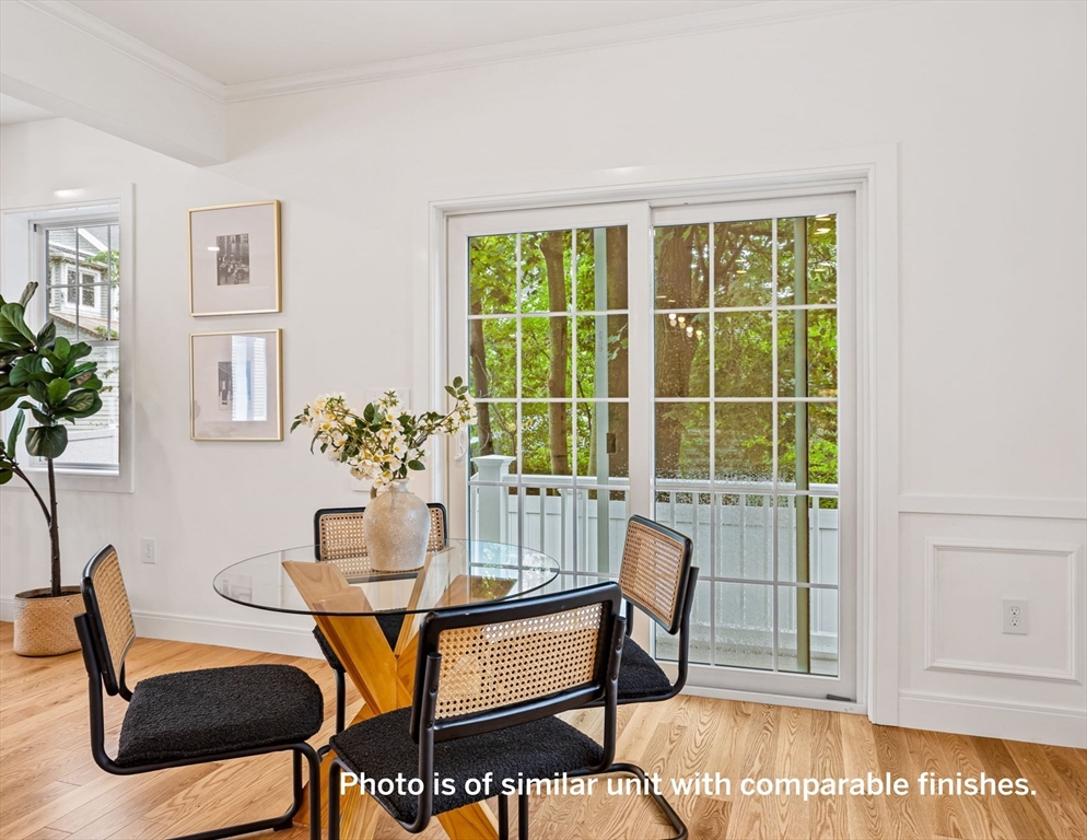 75 Franklin Street, Unit 1 Arlington, MA 02474 - Photo 14 of 36 a dining room with furniture and window